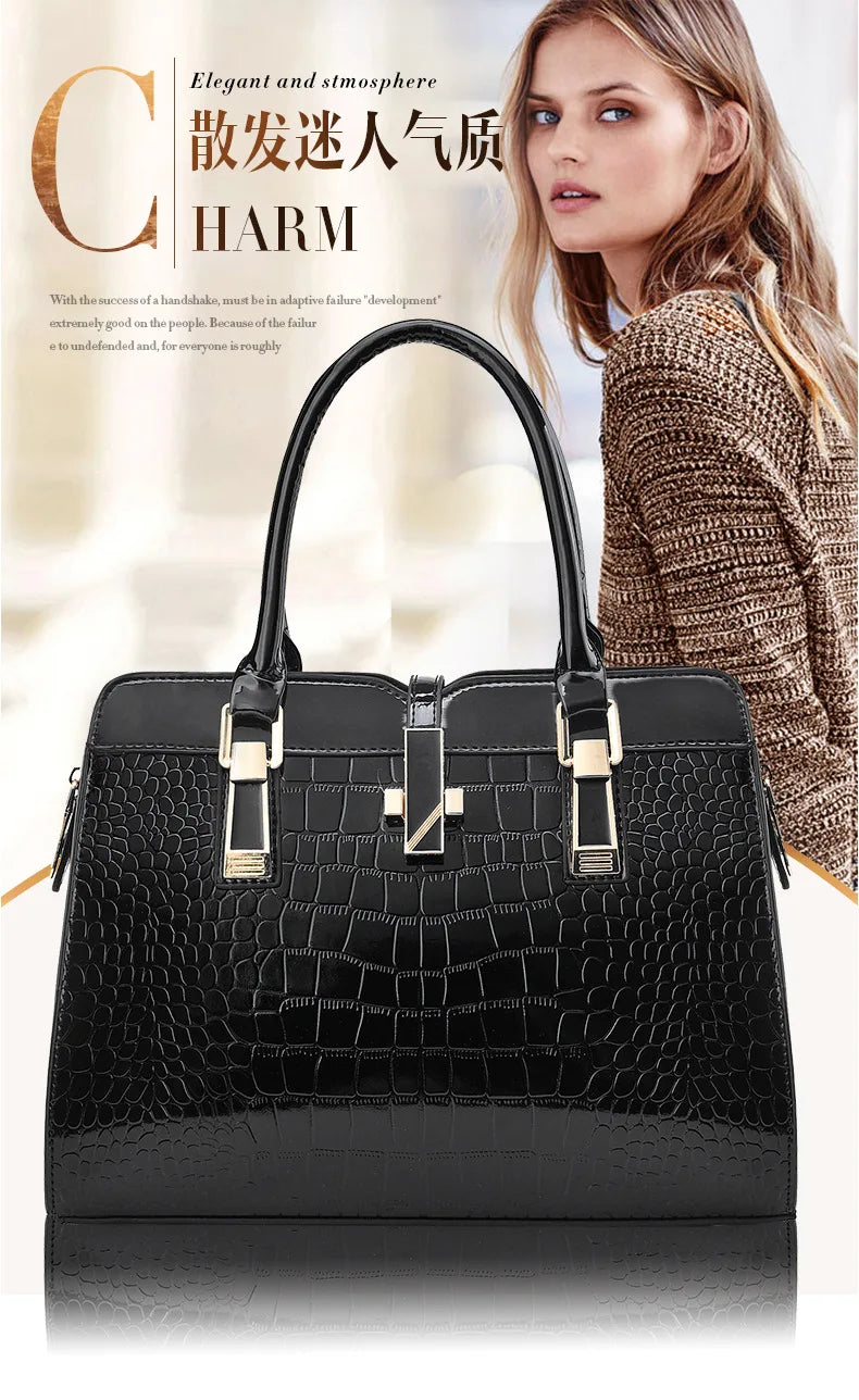 Black patent leather crocodile-pattern tote bag with dual top handles and gold hardware details.