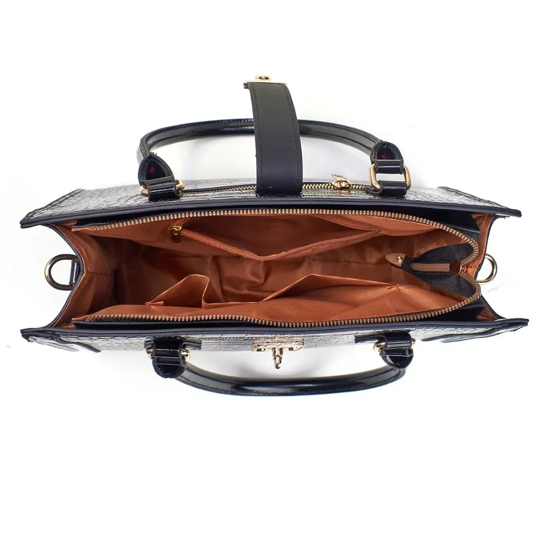 Black crocodile-pattern faux leather handbag open from above, revealing a brown fabric interior with multiple compartments.