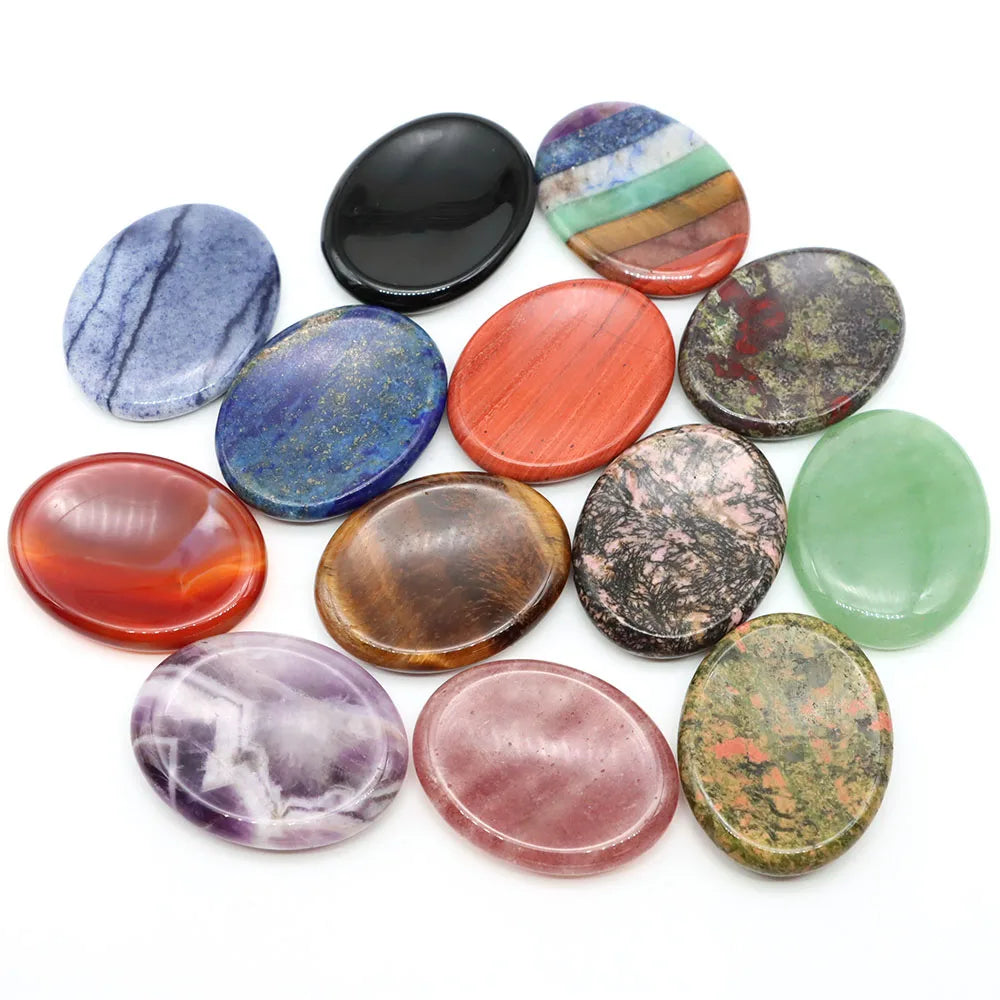 Smooth, hand-carved multicolored stone palm stones for meditation home decor to promote focus and relaxation.