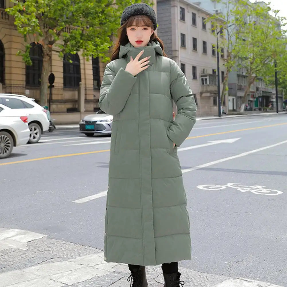 Women's long hooded coat with zip closure and side slits