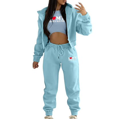 Light blue knit sweater set with hooded jacket and high waist joggers, featuring letter print for lounge wear.