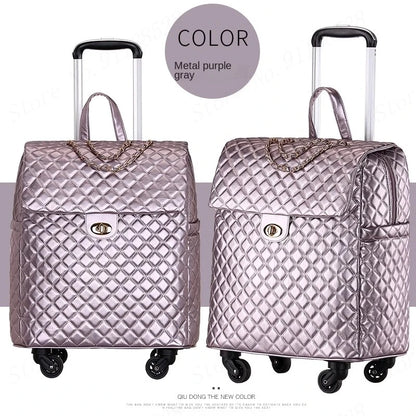 Metal purple-gray PU rolling suitcase with quilted diamond pattern, twist-lock flap, chain detail, and telescoping handle.