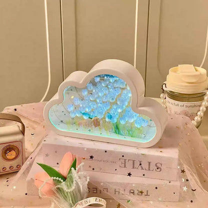 Cloud-shaped mirror with glowing blue tulip LED lights for desk decor.