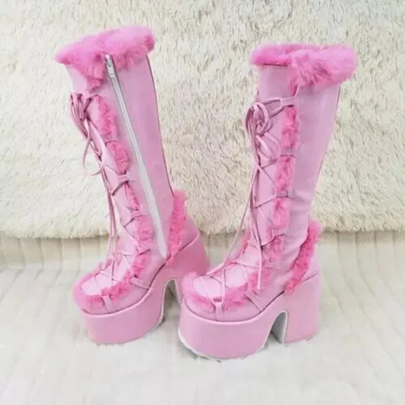 Pink faux fur mid-calf platform boots with wedge heels, front laces, and side zippers.