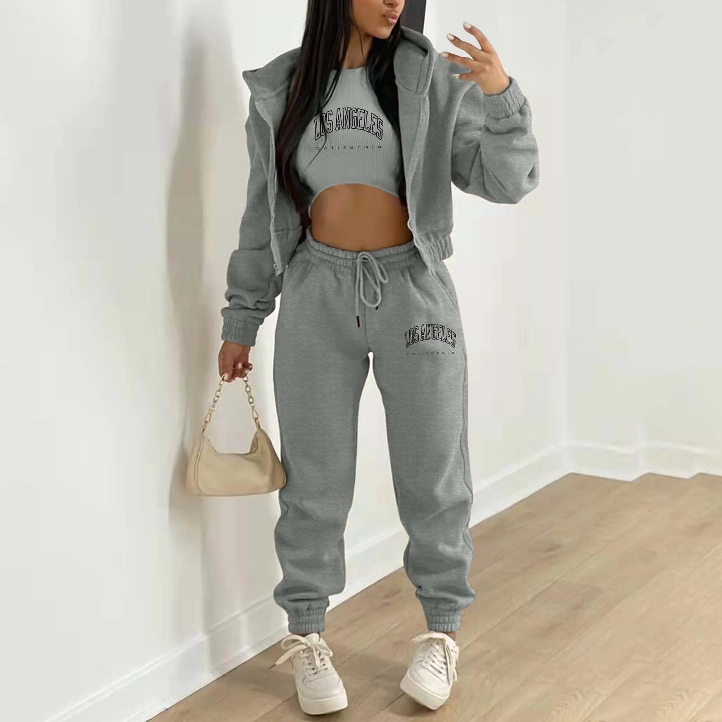 Grey knit sweater set with Los Angeles letter print, featuring a relaxed hooded jacket for lounging.
