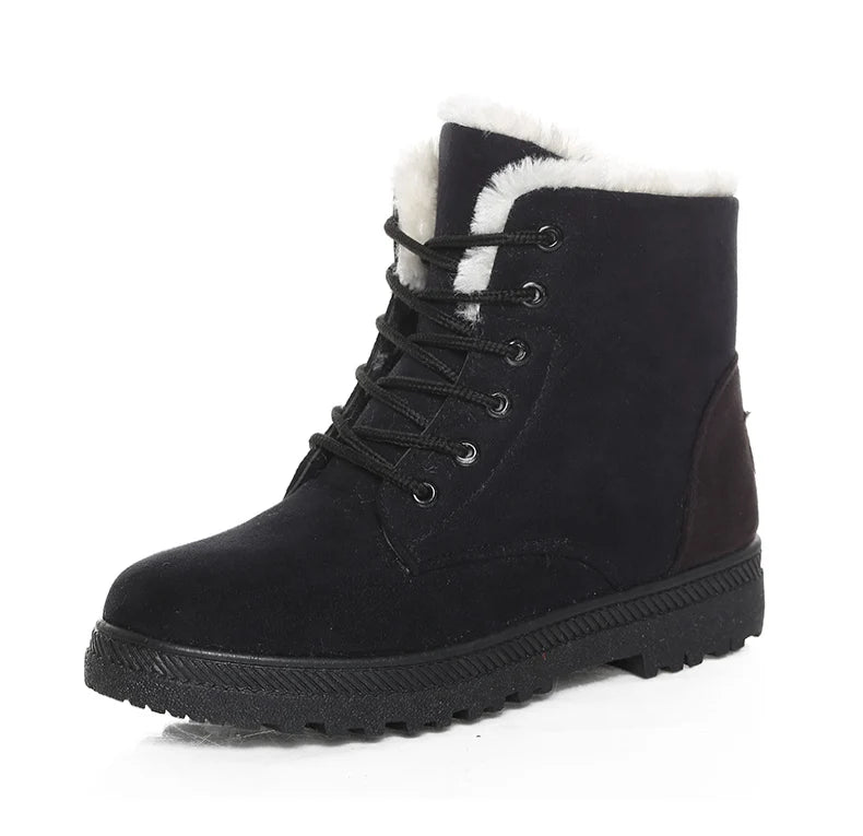 Black suede women's ankle snow boot with black laces, white faux fur lining, and ridged rubber sole.