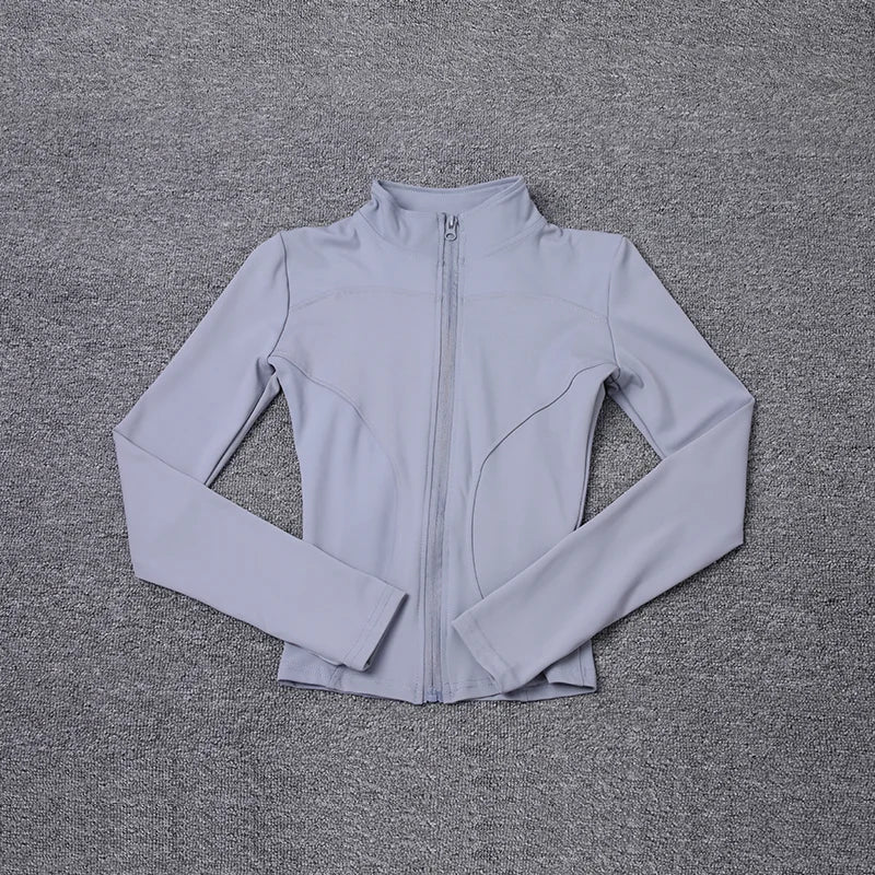 Light grey polyester long sleeve jacket with a front zip and fitted design for gym training and yoga.