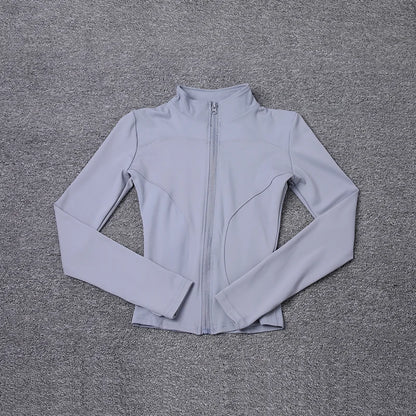 Light grey polyester long sleeve jacket with a front zip and fitted design for gym training and yoga.