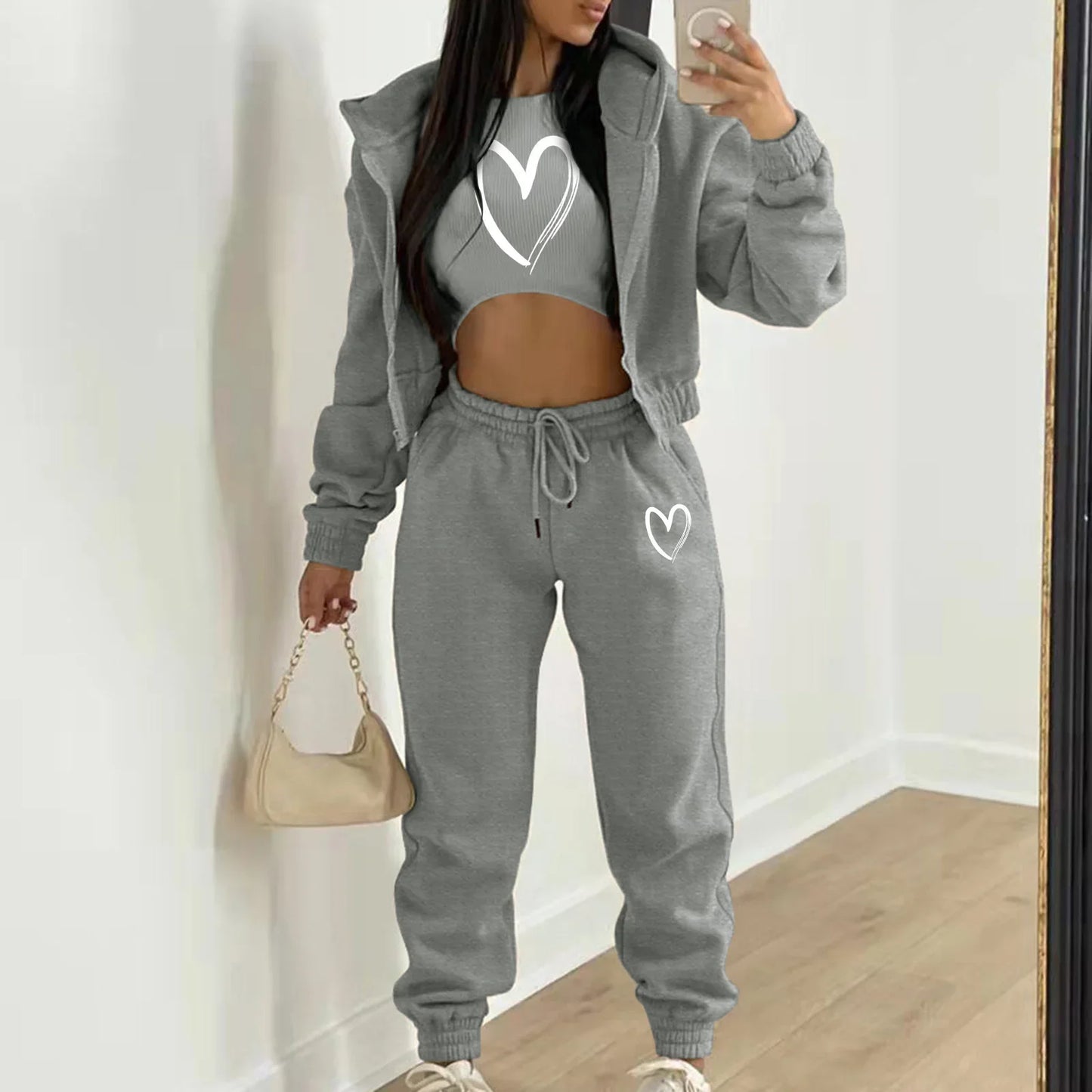 Grey plush knit sweater set with heart print and relaxed fit, a cozy loungewear clothing choice for casual days.