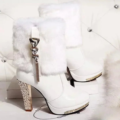 White winter high-heel boots with faux fur trim, platform soles, and rhinestone-encrusted heels and charms.