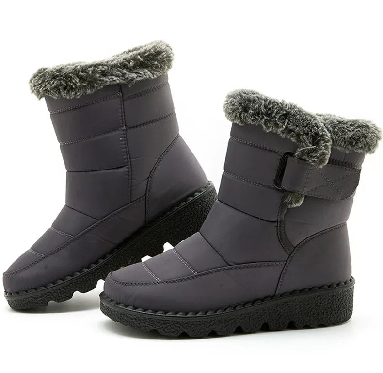 Dark grey nylon winter snow boots with faux fur trim, low heels, and black ridged rubber soles.