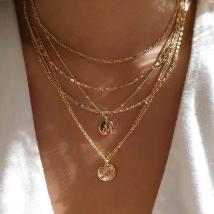 Layered crystal pendant necklace set with rhinestones and multi-strand chains