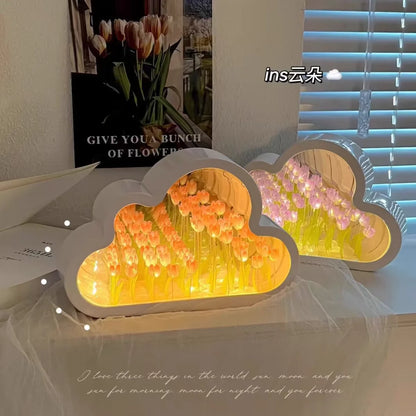 White cloud-shaped LED mirror panels with pink and orange tulip flowers for ambient home decor desk lighting.