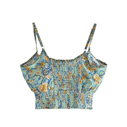 Sage green floral crop top with a stretchy smocked back and spaghetti straps, a flowy piece for a summer outfit.