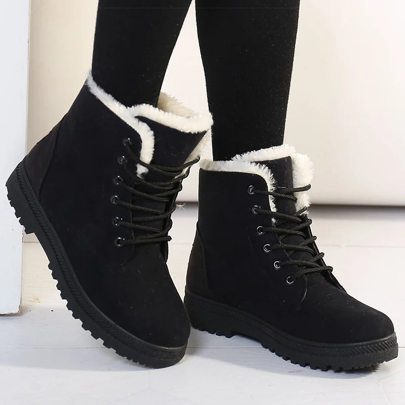 Black suede lace-up ankle snow boots with white faux fur lining and ridged rubber soles.