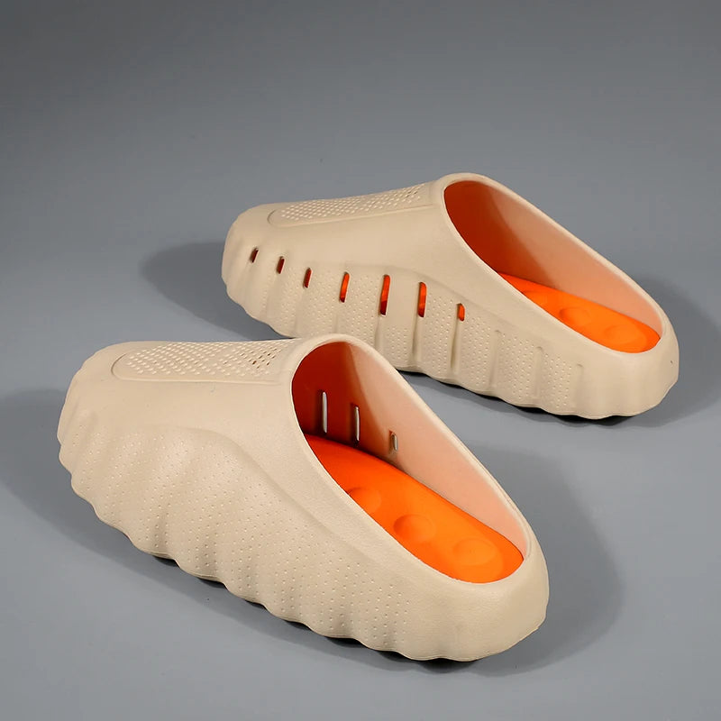Beige cushioned sandals with a thick platform sole and bright orange footbed for daily wear.
