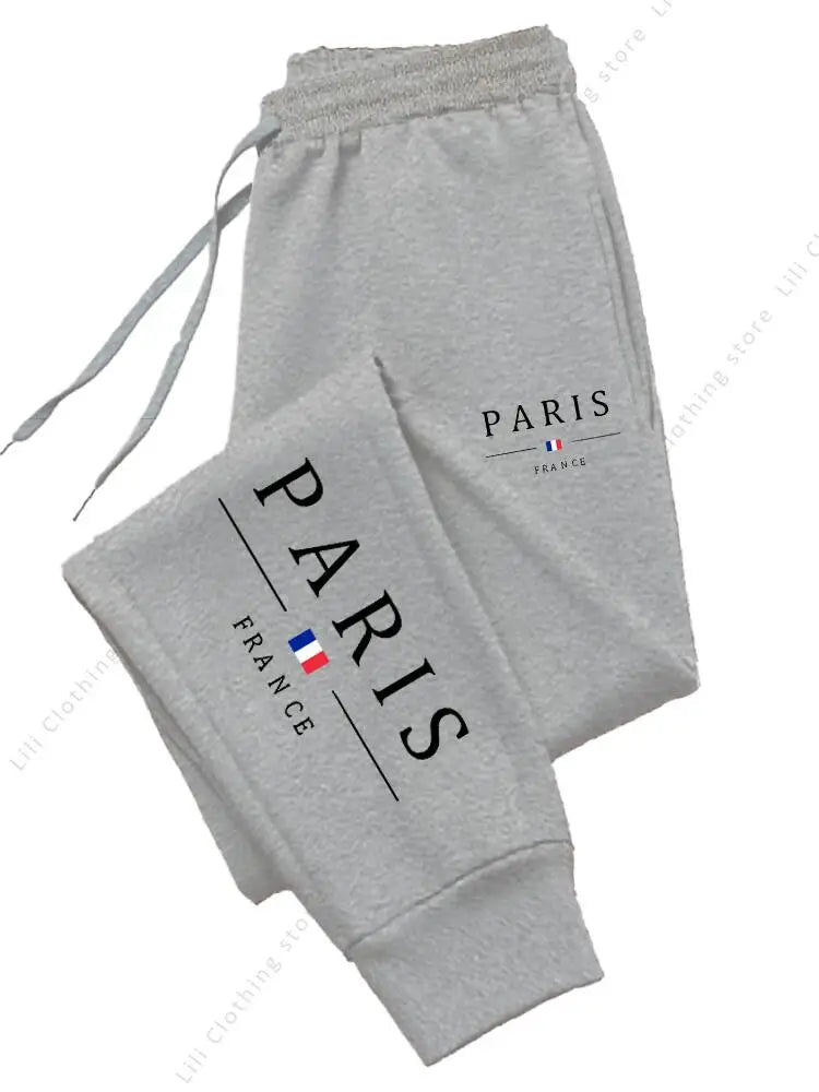Grey, fleece-lined, high waist jogger pants with a Paris France logo for cozy lounge wear.