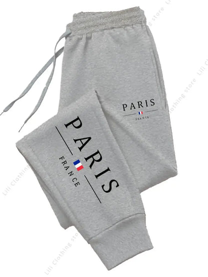 Grey, fleece-lined, high waist jogger pants with a Paris France logo for cozy lounge wear.