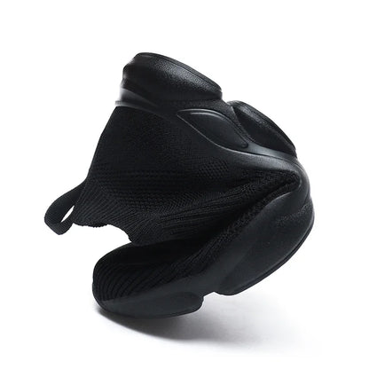 Black breathable knitted slip-on sneakers with a flexible sole for comfortable everyday walking.