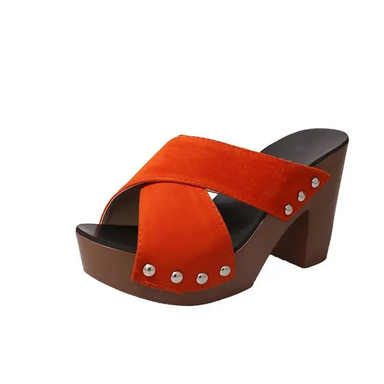 Orange flock platform sandals with a peep toe, silver rivets, and brown soles for everyday summer wear.