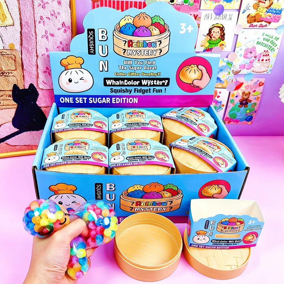 A hand squeezes a clear, multi-colored bead dumpling steamed bun slow rising squishy fidget toy in soft foam.