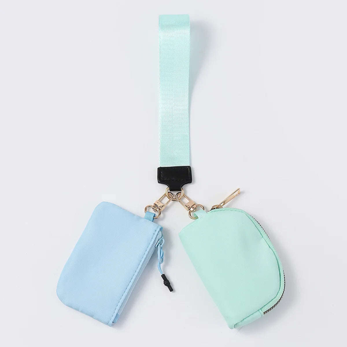 Light blue and mint nylon dual pouch wristlet wallet with zip closure for holding cards, coins, and keys.