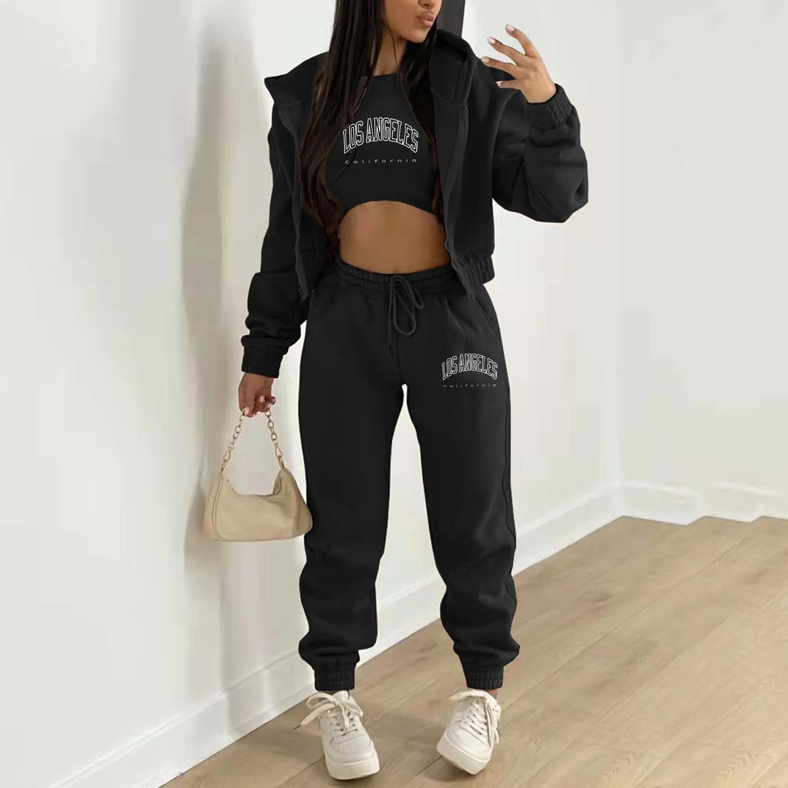 Black knit sweater set with white letter print, cropped top, hooded jacket, and high waist joggers for lounging.