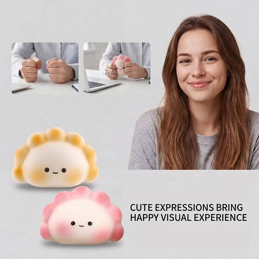 White and pink dumpling squeeze toy, portable fidget toy for desk stress relief with soft silicone surface.