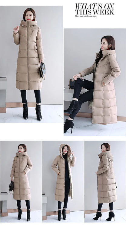 Beige long quilted puffer jacket with a hood, zipper closure, and side pockets worn over black pants and boots.