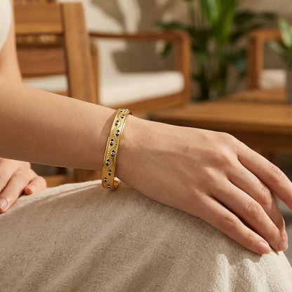 Women’s stainless steel cuff bracelet with an evil eye motif