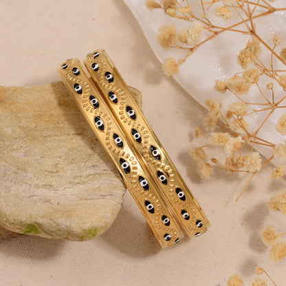 Women’s stainless steel cuff bracelet with an evil eye motif