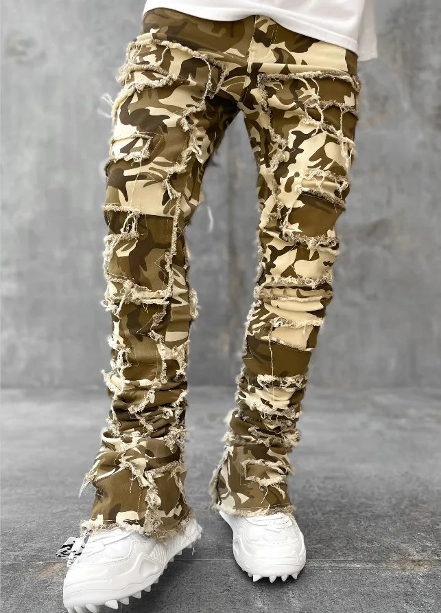 Tan and brown camo patchwork jeans with frayed distressed finish and fitted design for casual wear.