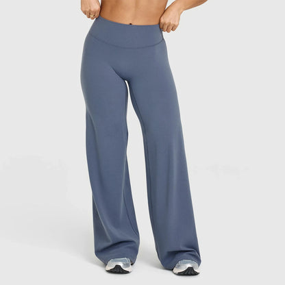 Blue high waist sculpting leggings in a seamless, stretchy knit fabric for yoga or workouts.