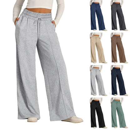 Grey high waist flowy pants with a fleece lining and drawstring waist for cozy winter loungewear.