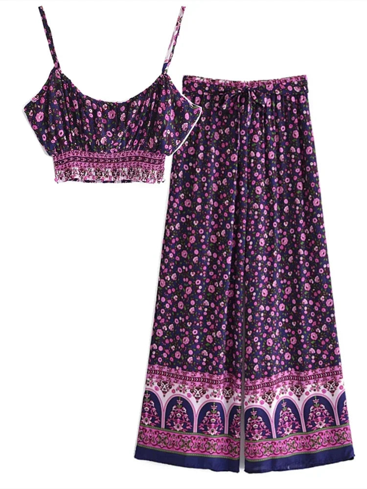 Navy blue floral print two-piece flowy set with a cropped tank and drawstring wide leg pants for a beach vacation.