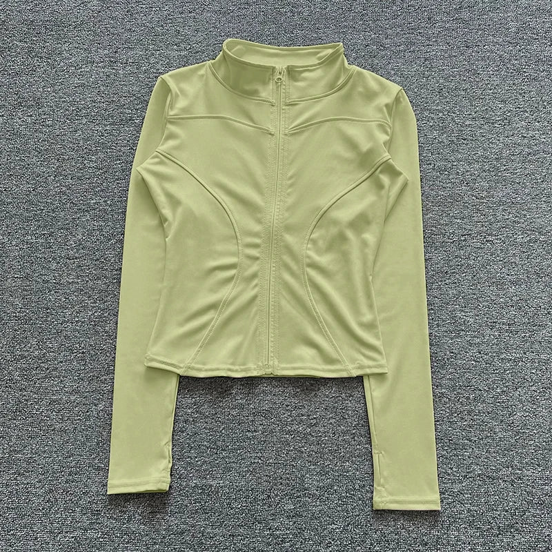 Light green fitted sport jacket with a zip closure and sculpting seams for gym training and yoga.