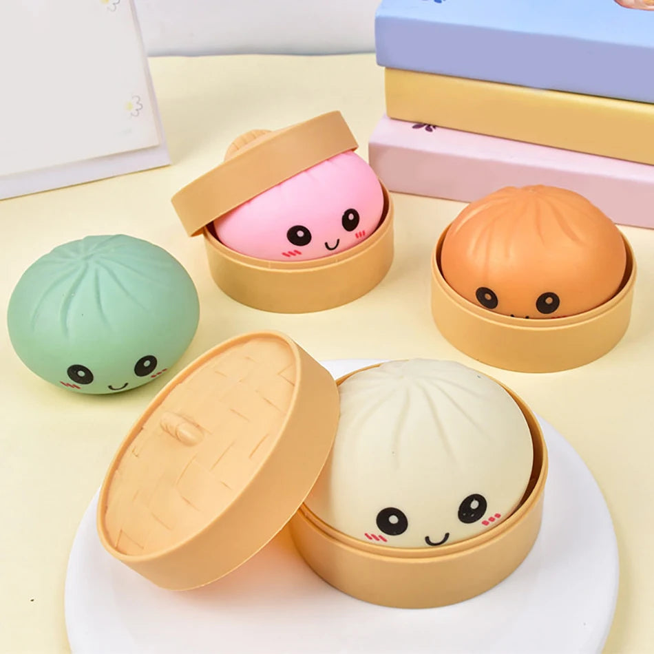 Colorful silicone dumpling squishies in bamboo-style containers, a tactile fidget toy for sensory play and stress relief.