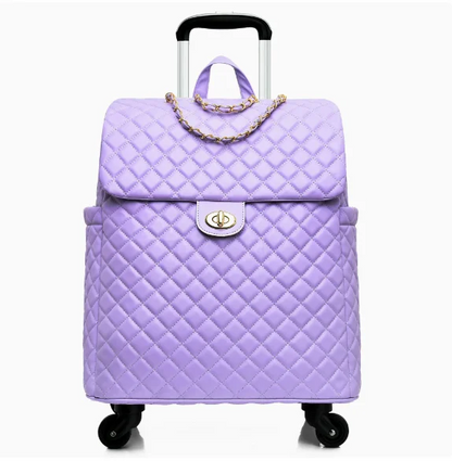 Lavender quilted leather rolling travel bag with gold chain accent, top handle, and extendable trolley handle.