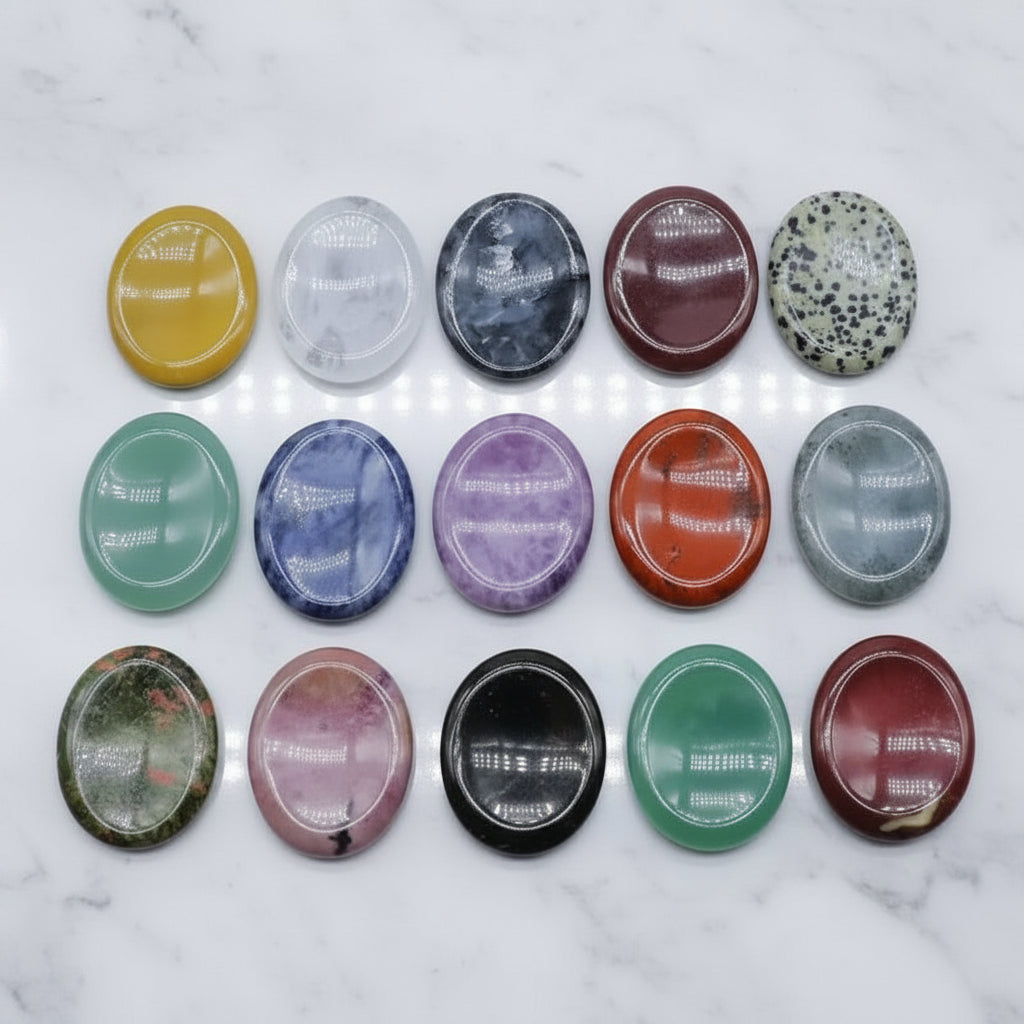 Smooth, hand-carved, multi-colored stone home decor for meditation, featuring an assortment of polished oval crystals.