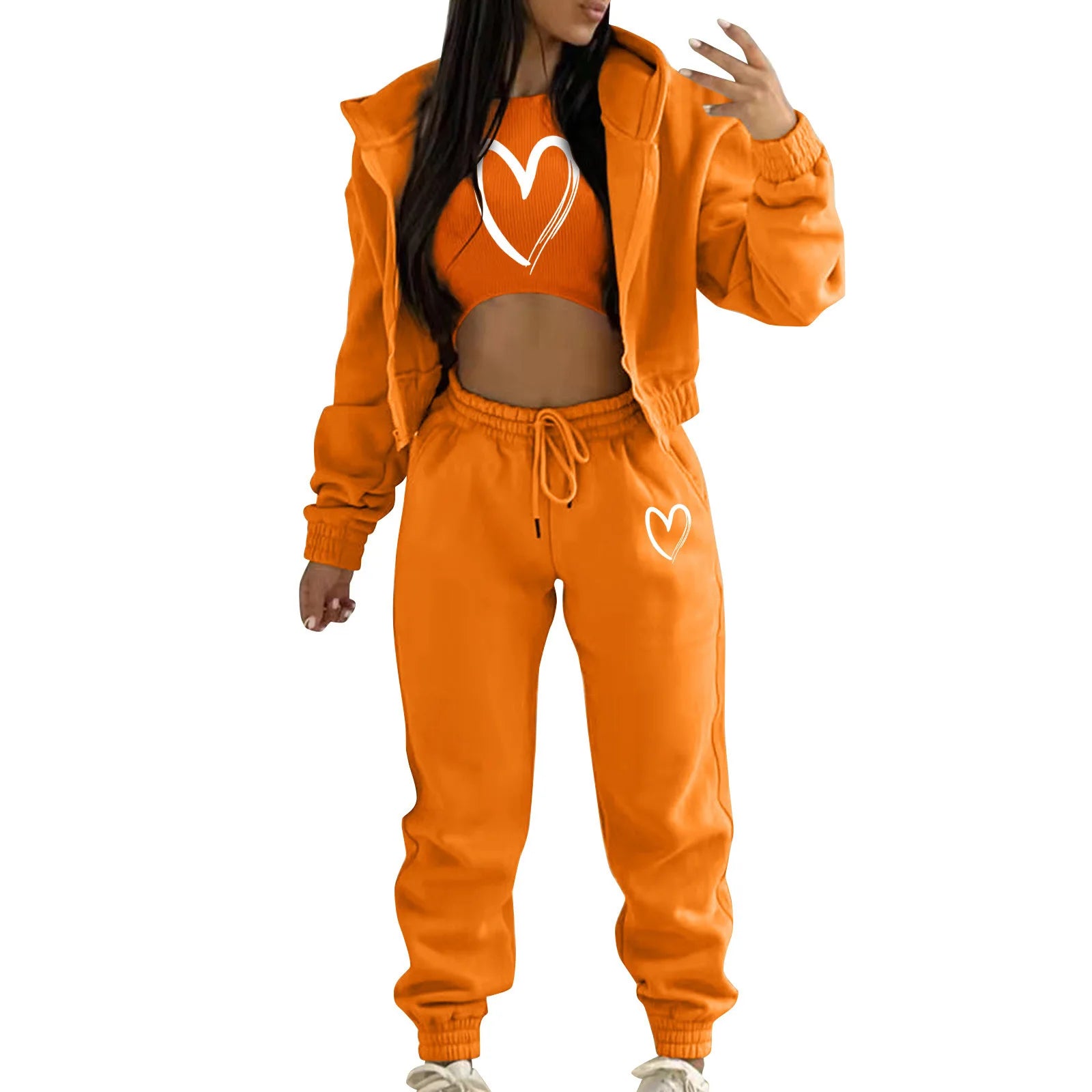 Orange plush knit sweater set with white heart print, featuring a hooded jacket and high waist joggers for lounging.