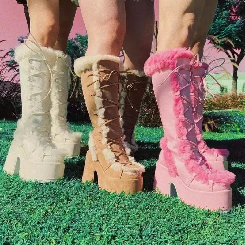 Platform wedge snow boots in white, tan, and pink with faux fur trim, lace-up fronts, and chunky heels.