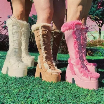 Platform wedge snow boots in white, tan, and pink with faux fur trim, lace-up fronts, and chunky heels.