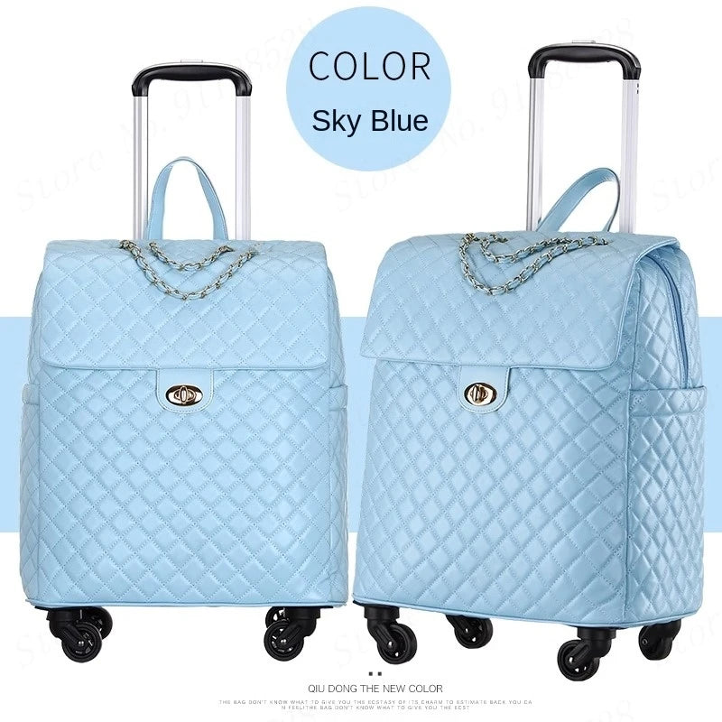 Sky blue quilted PU retro rolling luggage with chain detail, top handle, twist-lock flap, and wheels.