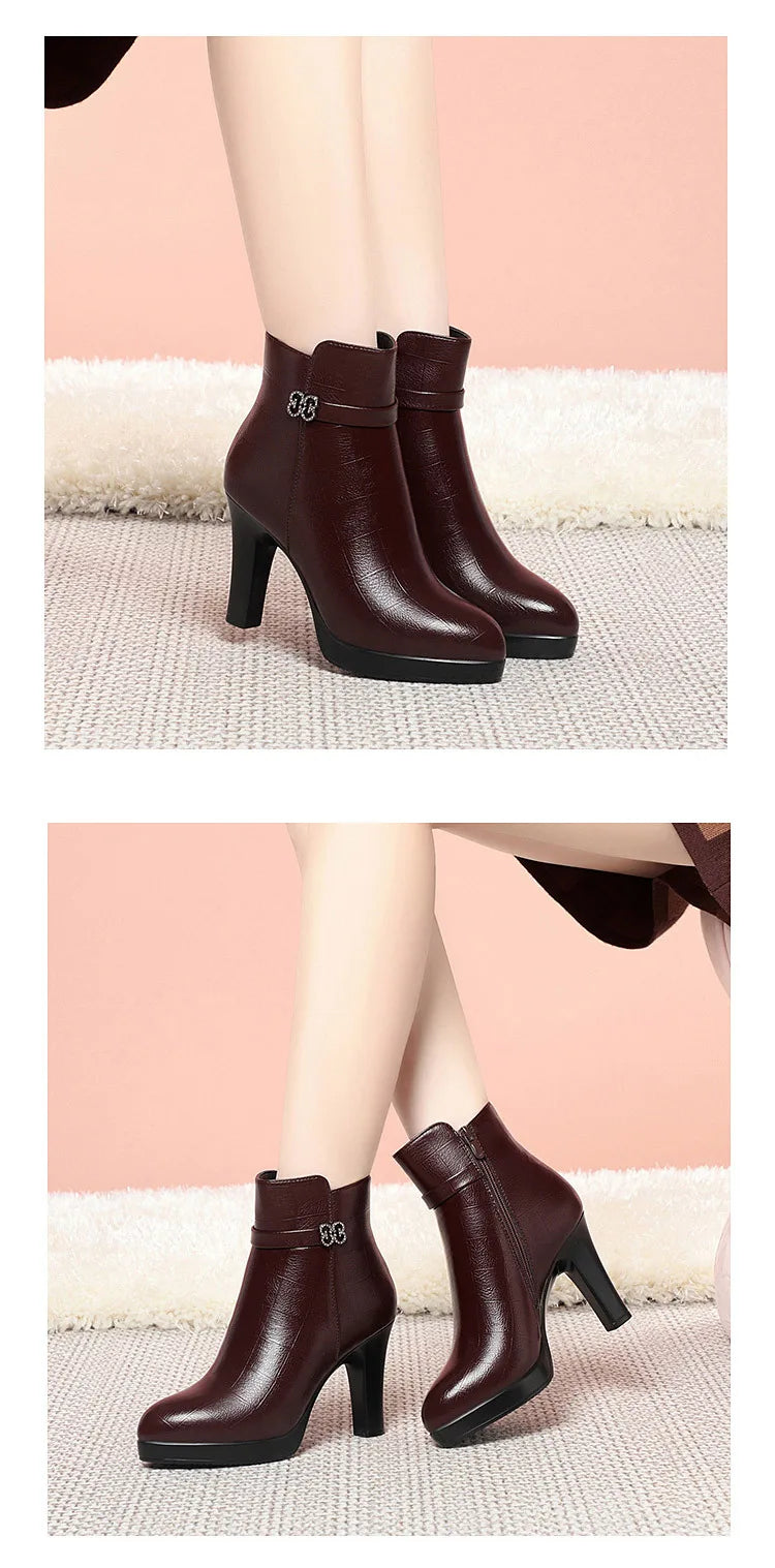 Burgundy leather ankle boots with high block heels, platform soles, and decorative side buckles.