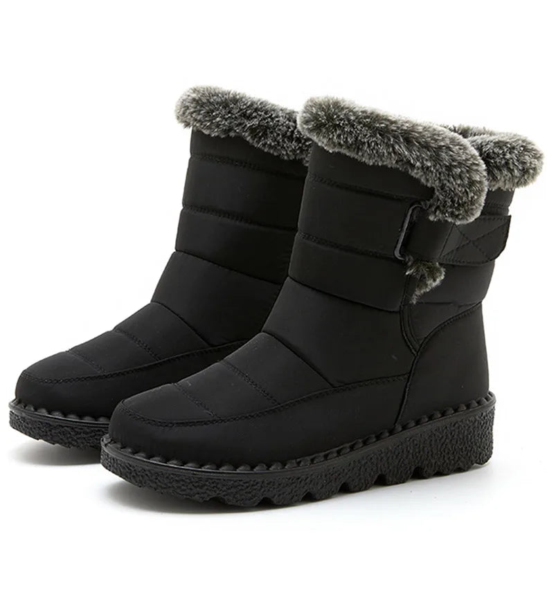 Black waterproof winter boots with quilted shafts, faux fur trim, side buckle, and textured rubber platform soles.