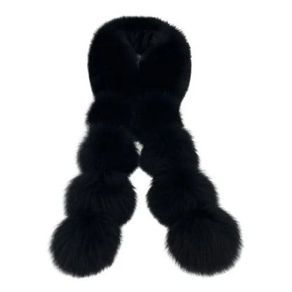 Black long faux fox fur scarf with pom-pom clusters on both ends.