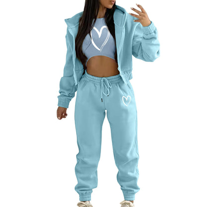 Light blue hooded knit sweater set with white heart print, featuring a relaxed, stretchy fit for lounging.