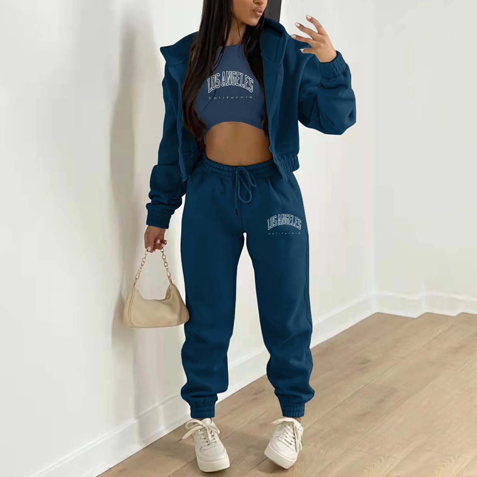 Blue plush knit sweater set with white letter print and high waist joggers for a relaxed loungewear look.