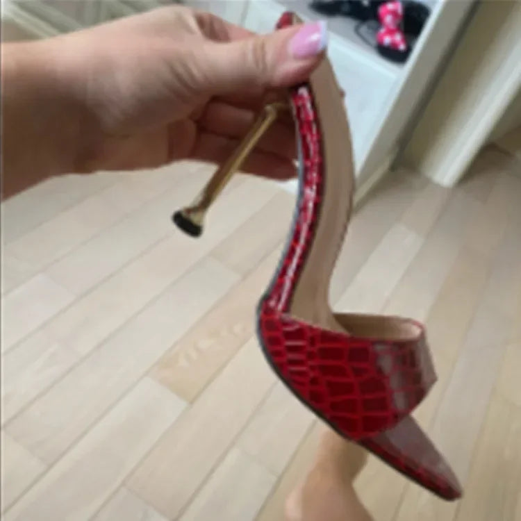 Red snake print slip-on heels with a metallic gold stiletto heel for formal events.