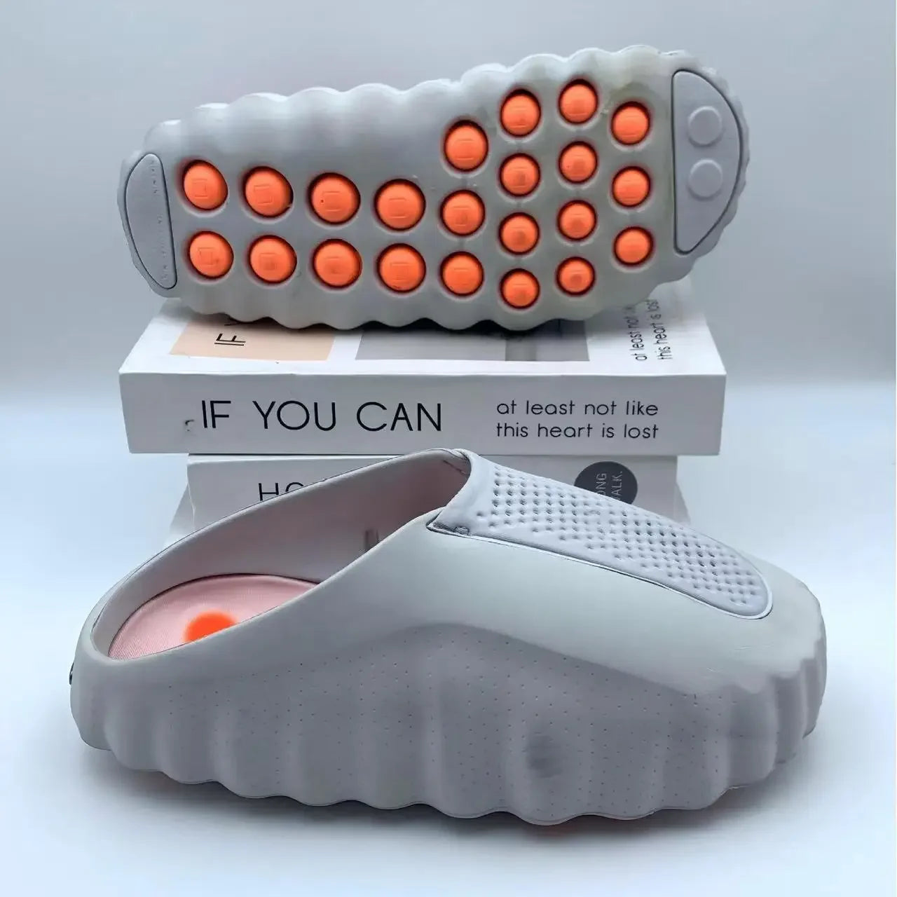 Grey EVA sandals with orange massage nodules and non-slip soles for comfortable daily wear.
